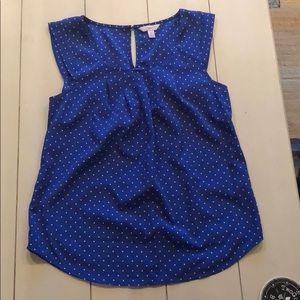 Blue and white polka dot top.